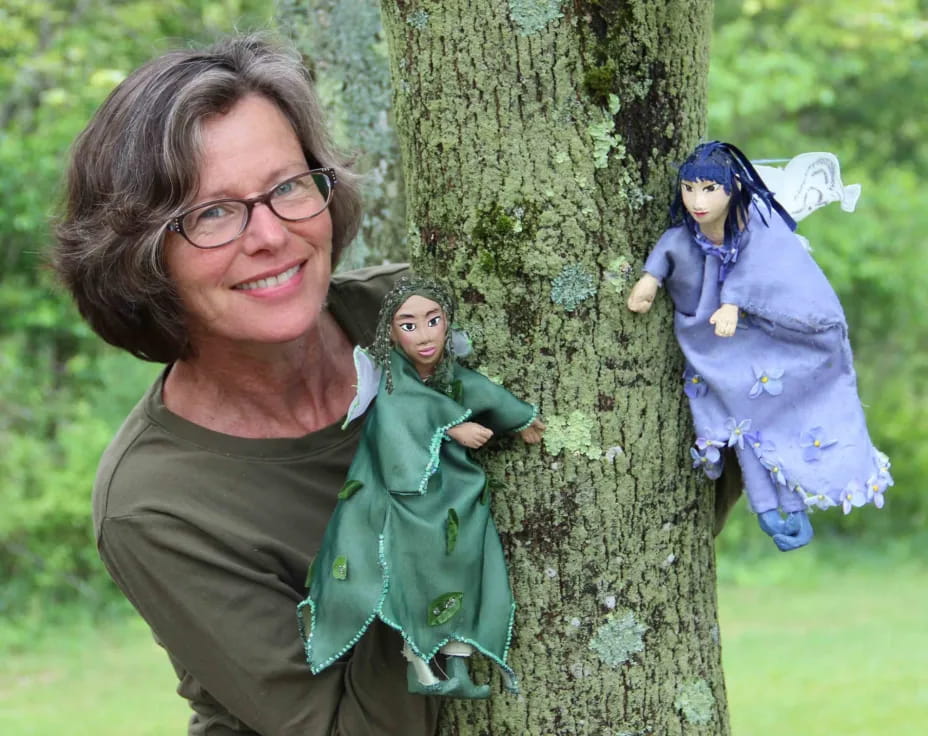 a person holding a baby in a tree