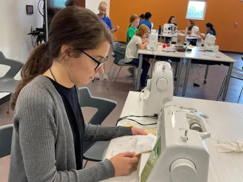 a woman using a microscope