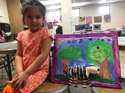 a girl sitting on a table