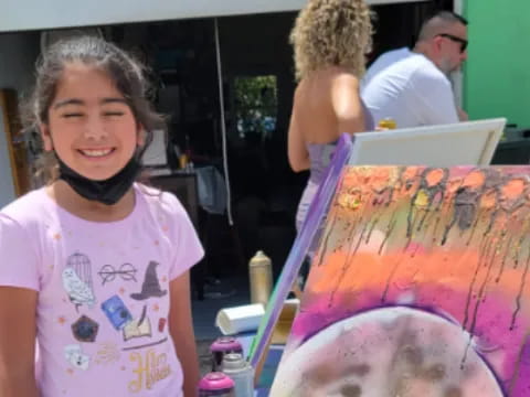 a young girl painting