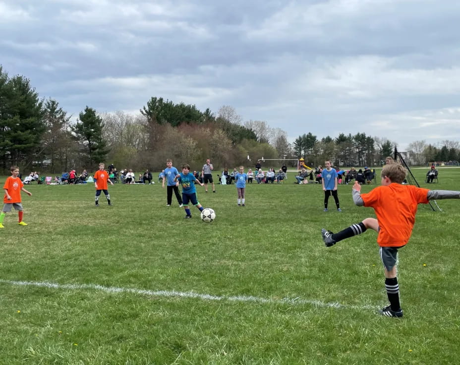 a group of people play football
