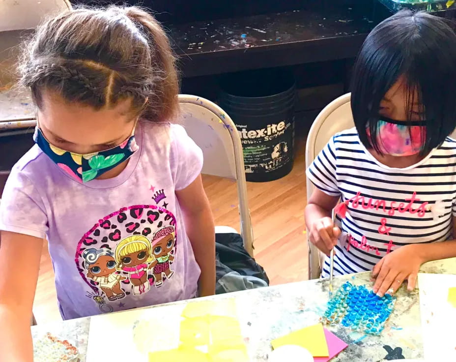 a couple of kids wearing masks