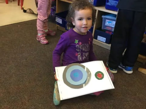 a child holding a toy