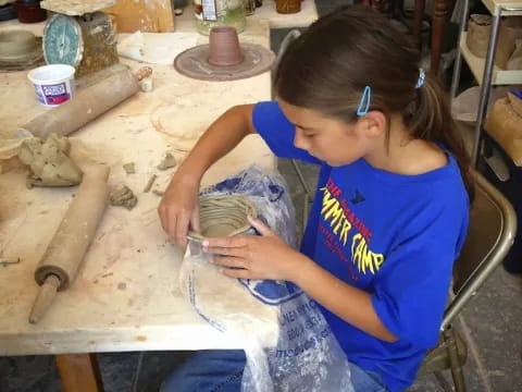 a young girl painting