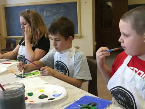a group of children painting