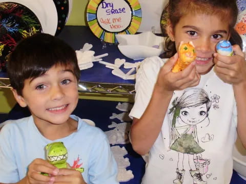 a couple of kids eating food