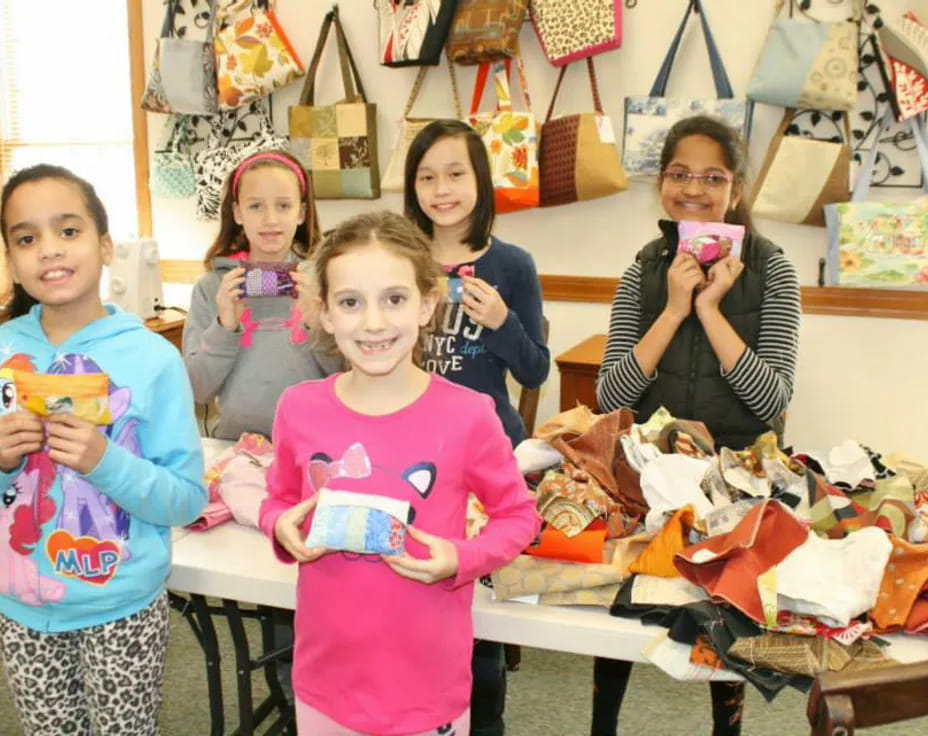 a group of girls holding objects