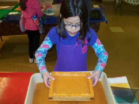 a girl making a cake