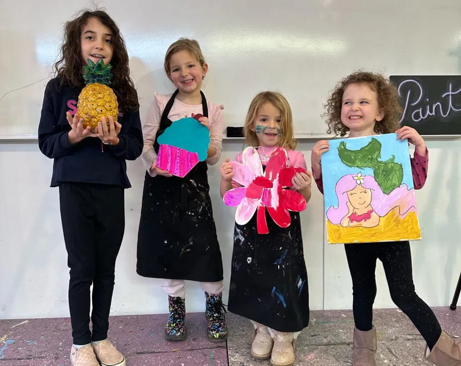 a group of girls holding flowers