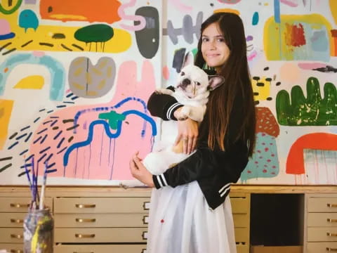 a person holding a dog