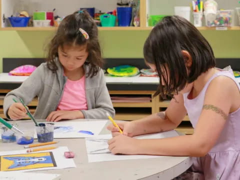 a few young girls painting