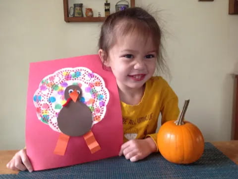 a girl holding a cake
