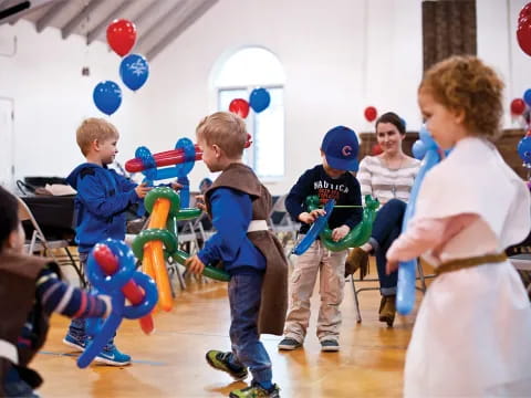 a group of kids playing with toys