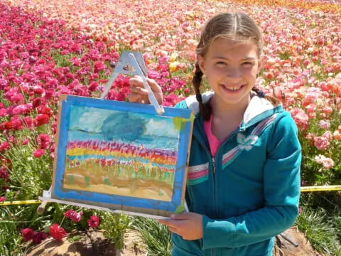 a girl holding a box