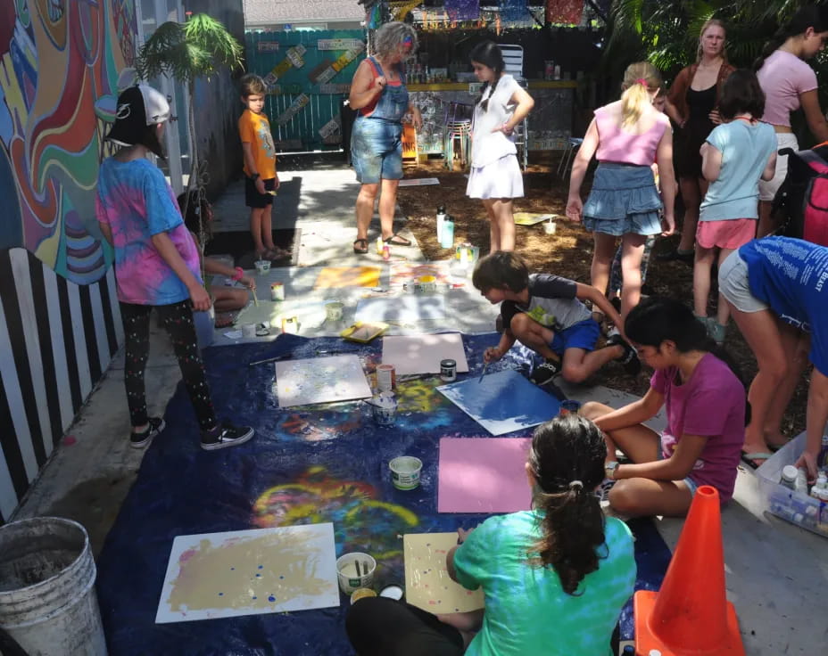a group of people painting