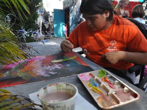 a person painting on a table