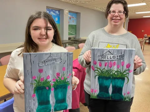 a couple of women holding flowers