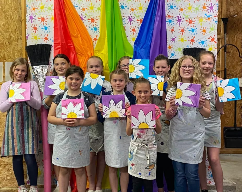 a group of children holding signs