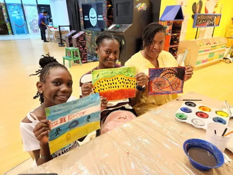 a group of children painting