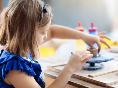 a young girl painting