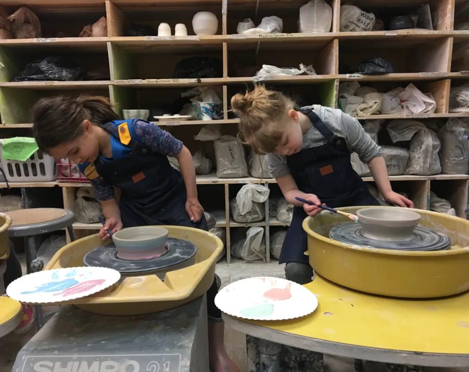 kids making clay pots