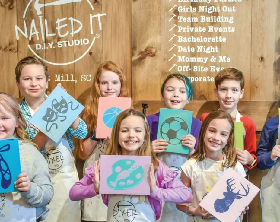 a group of children holding books