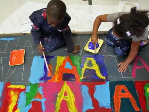 a couple of kids painting