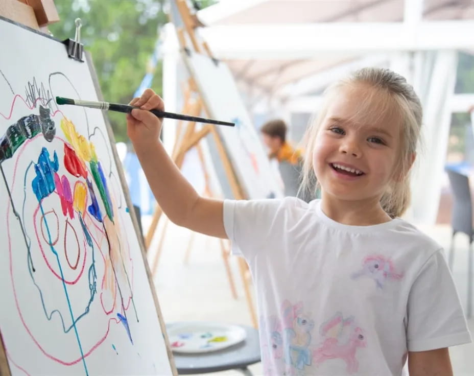 a young girl painting