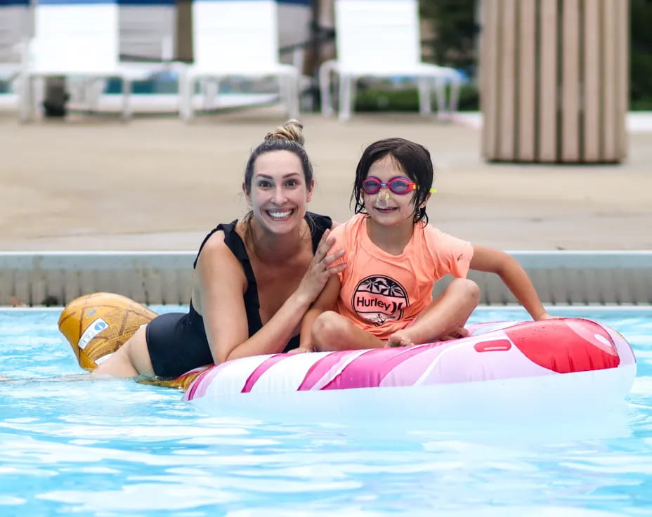 a couple of women in a pool