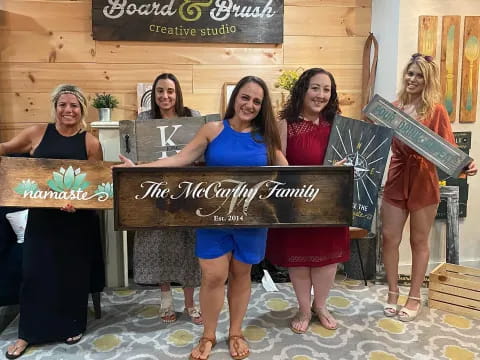 a group of women holding a sign