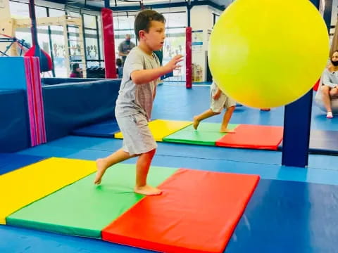 a boy playing on a playground