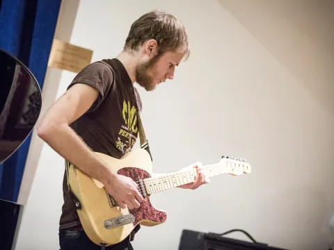 a man playing a guitar