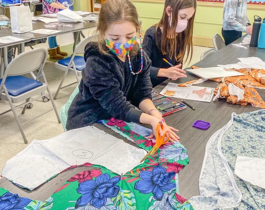 a group of children painting