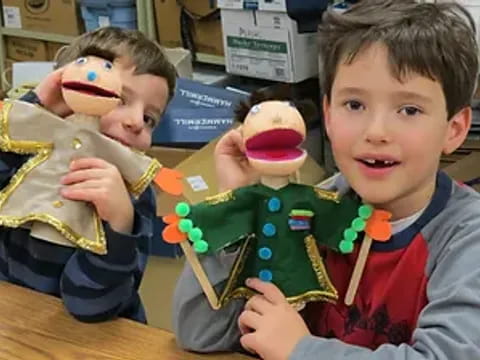 a couple of boys holding toys