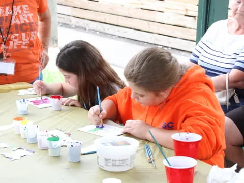 a group of people painting