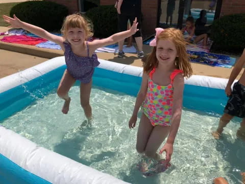 a couple of children in a pool