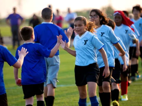 a group of people in blue shirts