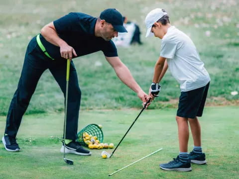 a couple of men playing golf