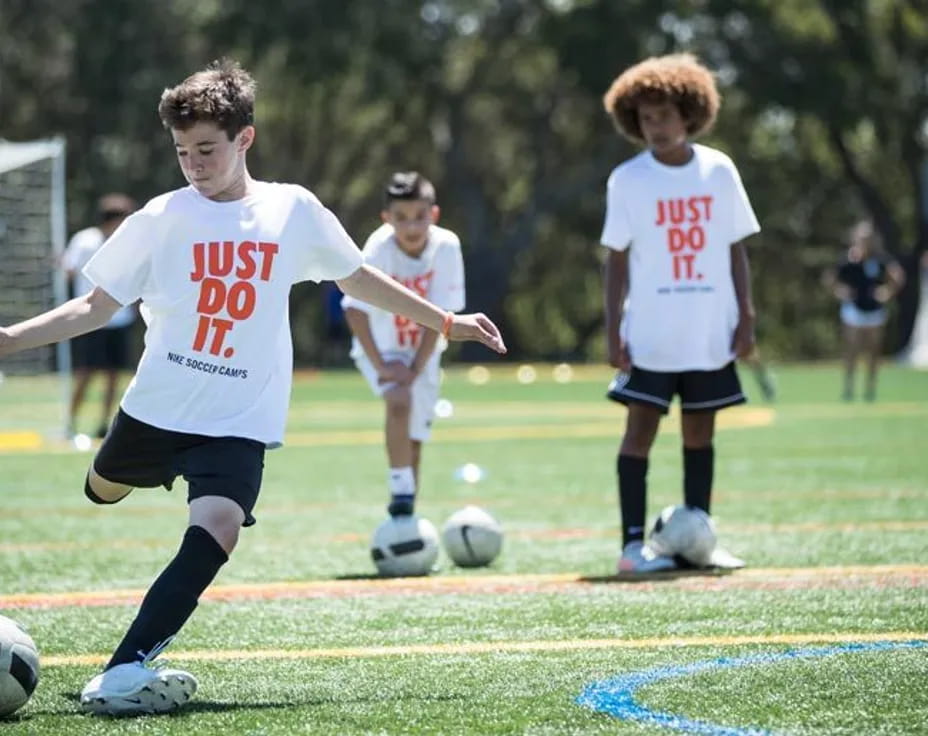 a group of kids playing football