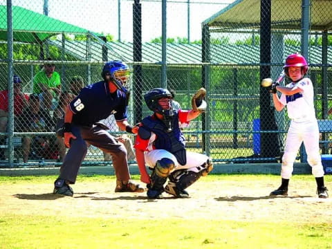 a kid swinging a baseball bat