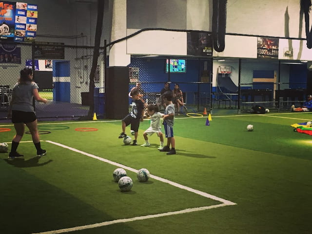 a group of kids playing football