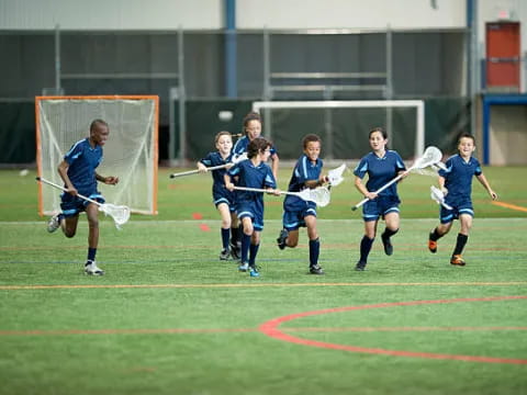 a group of kids playing football