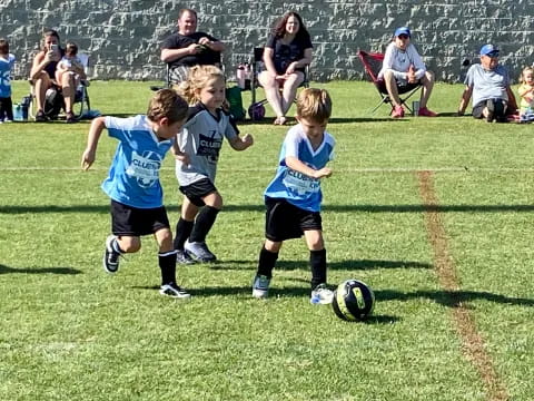 kids playing football on a field