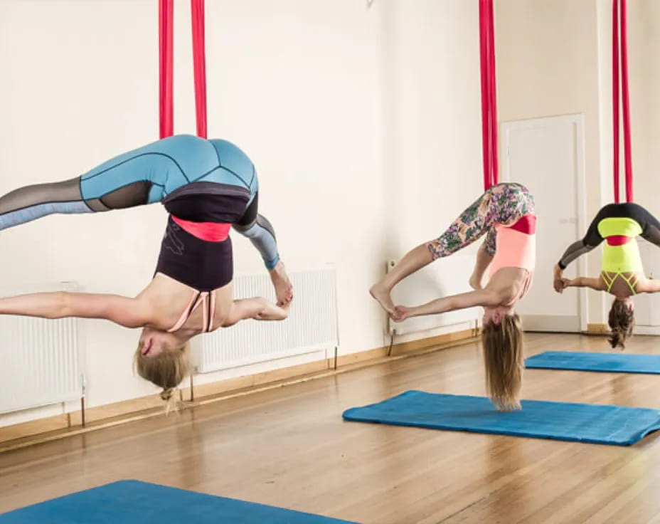 a group of women doing yoga