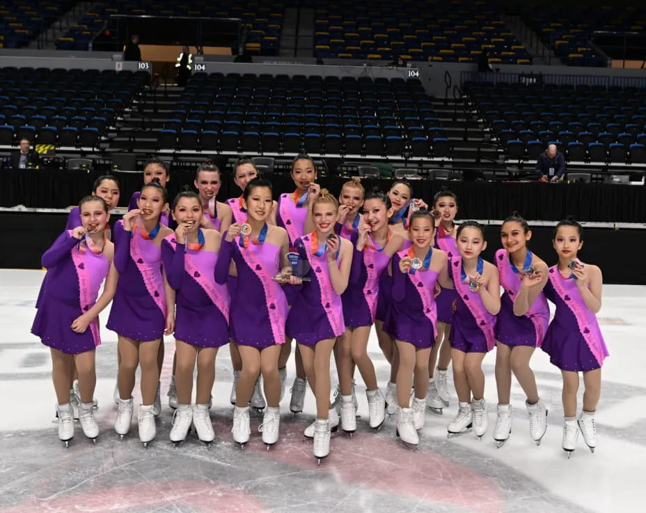 a group of women in purple uniforms