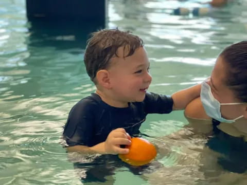a boy playing in the water