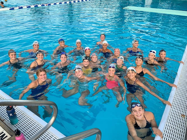a group of people in a pool