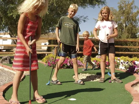 a group of people playing golf
