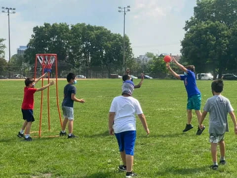 a group of people playing frisbee