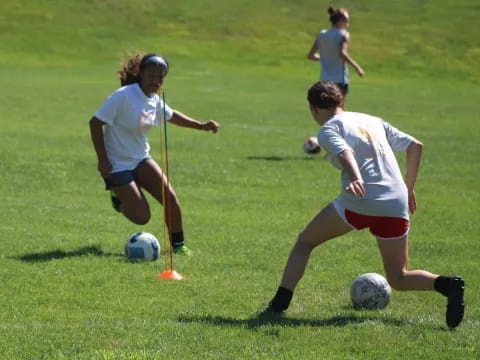 a group of girls playing football